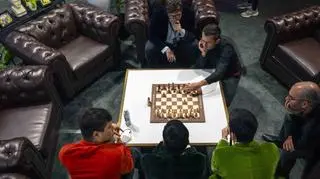 July 17,, 2025 - Las Vegas, Nevada, USA - Prior to the start of play on day two, players discuss how to deal with the scrambled board of freestyle chess during the $750,000 Freestyle Chess Grand Slam event at the Wynn Las Vegas.