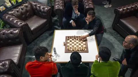 July 17,, 2025 - Las Vegas, Nevada, USA - Prior to the start of play on day two, players discuss how to deal with the scrambled board of freestyle chess during the $750,000 Freestyle Chess Grand Slam event at the Wynn Las Vegas.