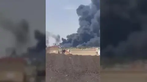 Black smoke rises 
