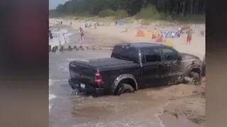The car got stuck in the sand