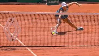 Iga Światek sliding on Roland Garros clay