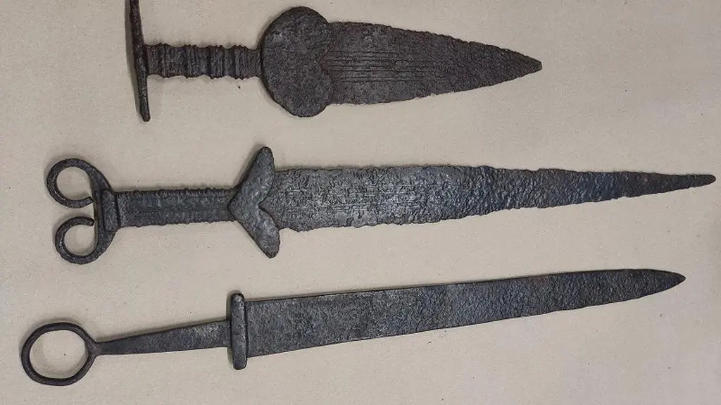 There were three ancient swords in the parcel