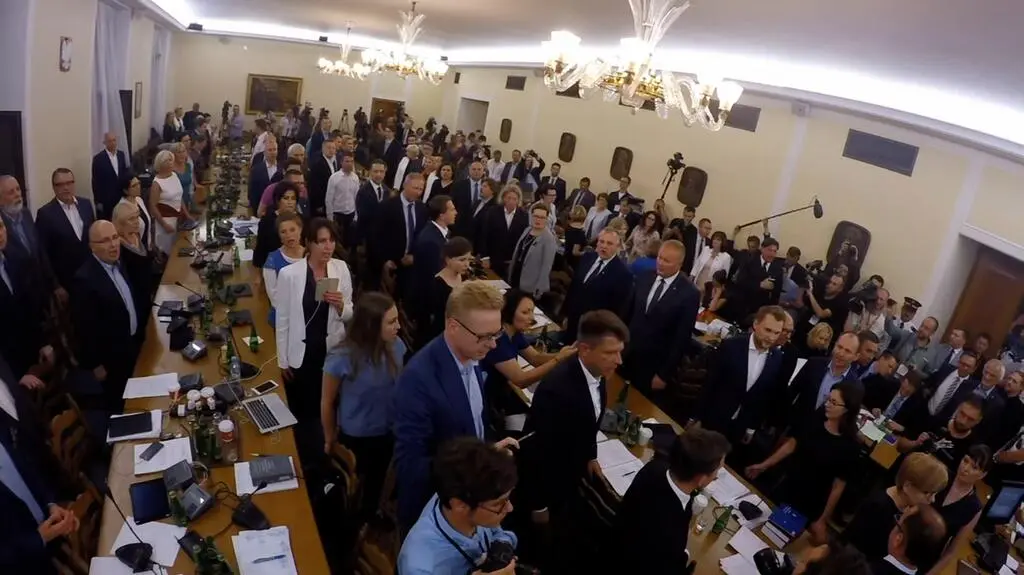 Opposition lawmakers sang the Polish national anthem during the vote