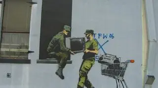 Graffiti "New Orleans military soldiers stealing a TV"