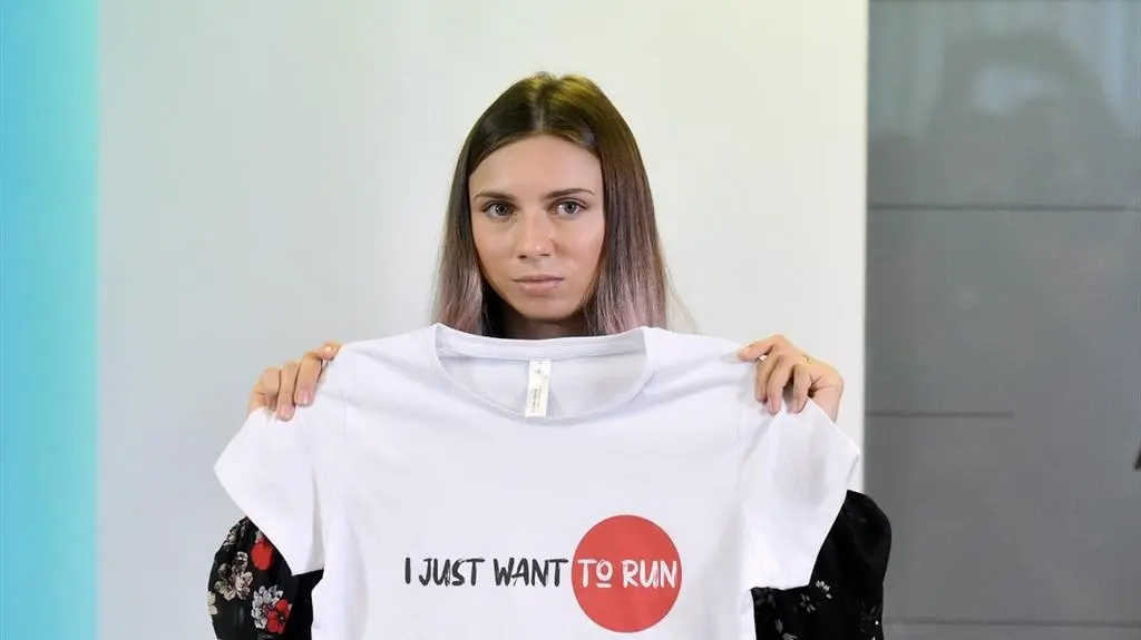 Krystsina Tsimanouskaya with a T-shirt saying: "I Just Want to Run"
