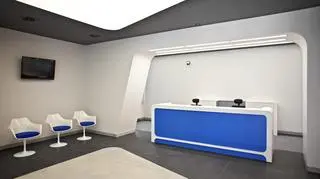 Widok na recepcję i nowoczesne krzesła w holu