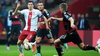 Poland's skipper Robert Lewandowski against German players
