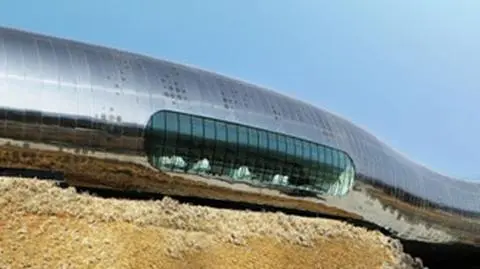 Muzeum prahistorii, jak wijący się robak