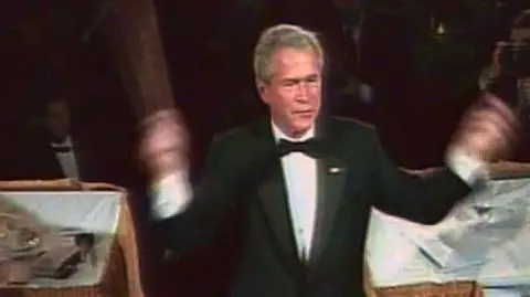 George Bush z batutą w ręku