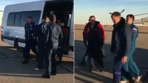 Astronauci na płycie lotniska w Żezkazganie