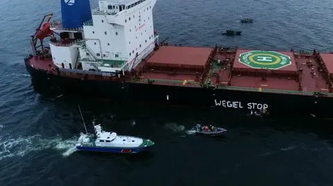 The activists painted "stop coal" on the side of the cargo vessel with the coal shipment