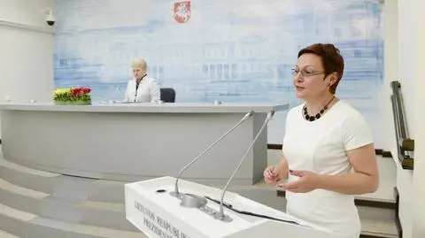 Daiva Ulbinaite i prezydent Dalia Grybauskaite (w tle)