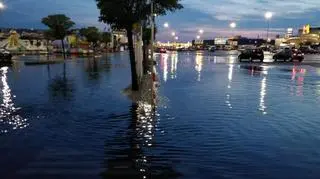 Flooded parking lot in front of a shopping mall in Targówek