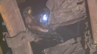 The rescuers are forced to cut through contorted mining equipment