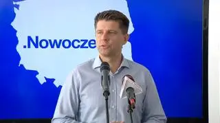 Ryszard Petru na tle nowego logo swojego ugrupowania