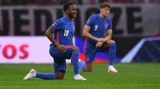 Raheem Sterling kneels before kick-off