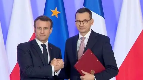 French President Macron and Polish PM Morawiecki celebrate signing a declaration of European policy cooperation