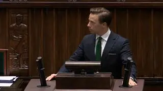Krzysztof Bosak behind the pulpit in the lower house