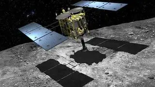 Artystyczna wizja Hayabusa 2 lądującego na powierzchni planetoidy (JAXA)