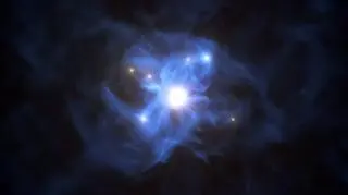 Artystyczna wizja supermasywnej czarnej dziury otoczonej sześcioma galaktykami (ESO/L. Calçada)