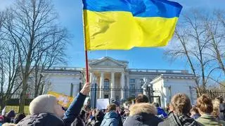 Ukrainian flag waving in front of the Russian Embassy in Warsaw