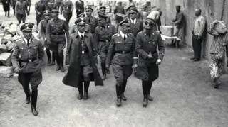 Franz Kutschera (in long coat) walking along Heinrich Himmler