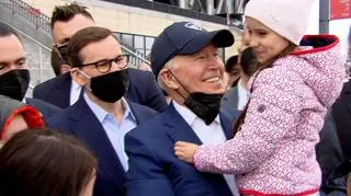 Joe Biden holding a Ukrainian girl