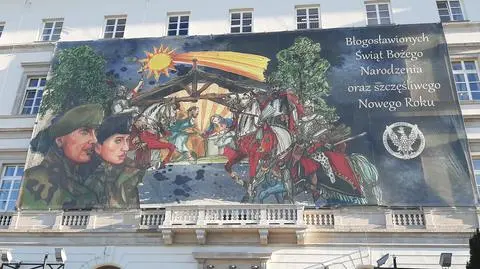 Żołnierze i husarze pilnują Świętej Rodziny. Autorem grafiki jest twórca muralu Zenka Martyniuka