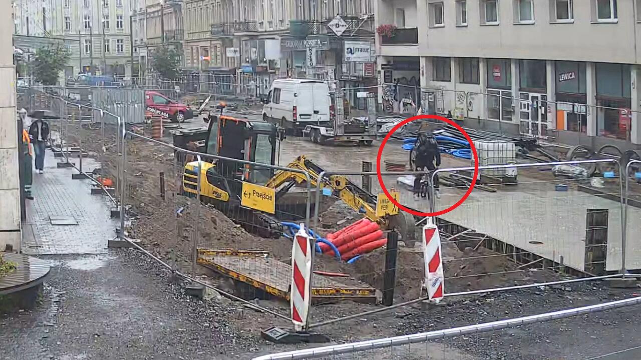 Cyclist rides into fresh concrete on construction site in Poznań