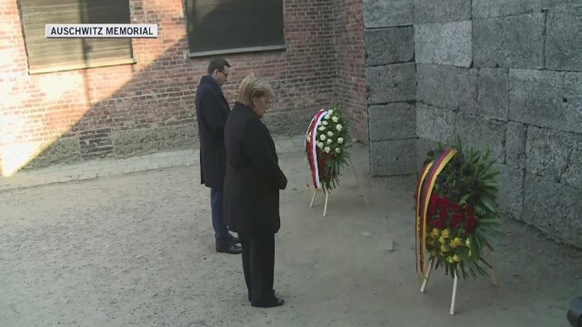 German Chancellor and Polish PM pay wreaths at Auschwitz Death Wall