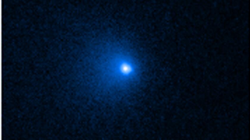Ciężkie pierwiastki w gazowych otoczkach komet